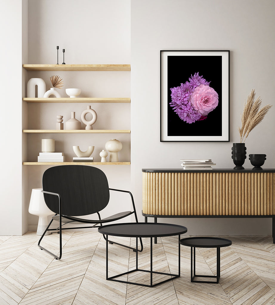 Modern living room with black chair, coffee table, and wooden cabinet.
