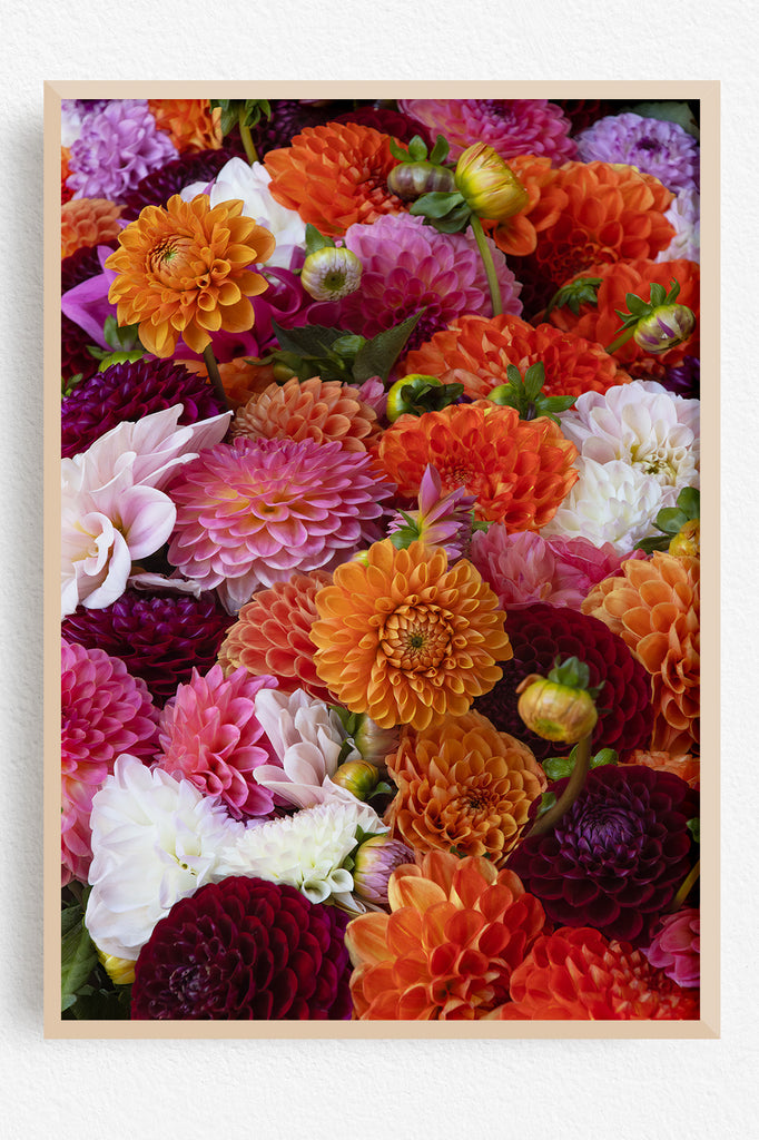 Framed artwork of colorful flowers with a wooden frame.