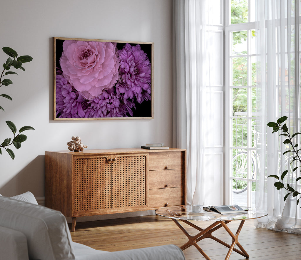 Living room with wooden cabinet, glass coffee table, and floral artwork on the wall.